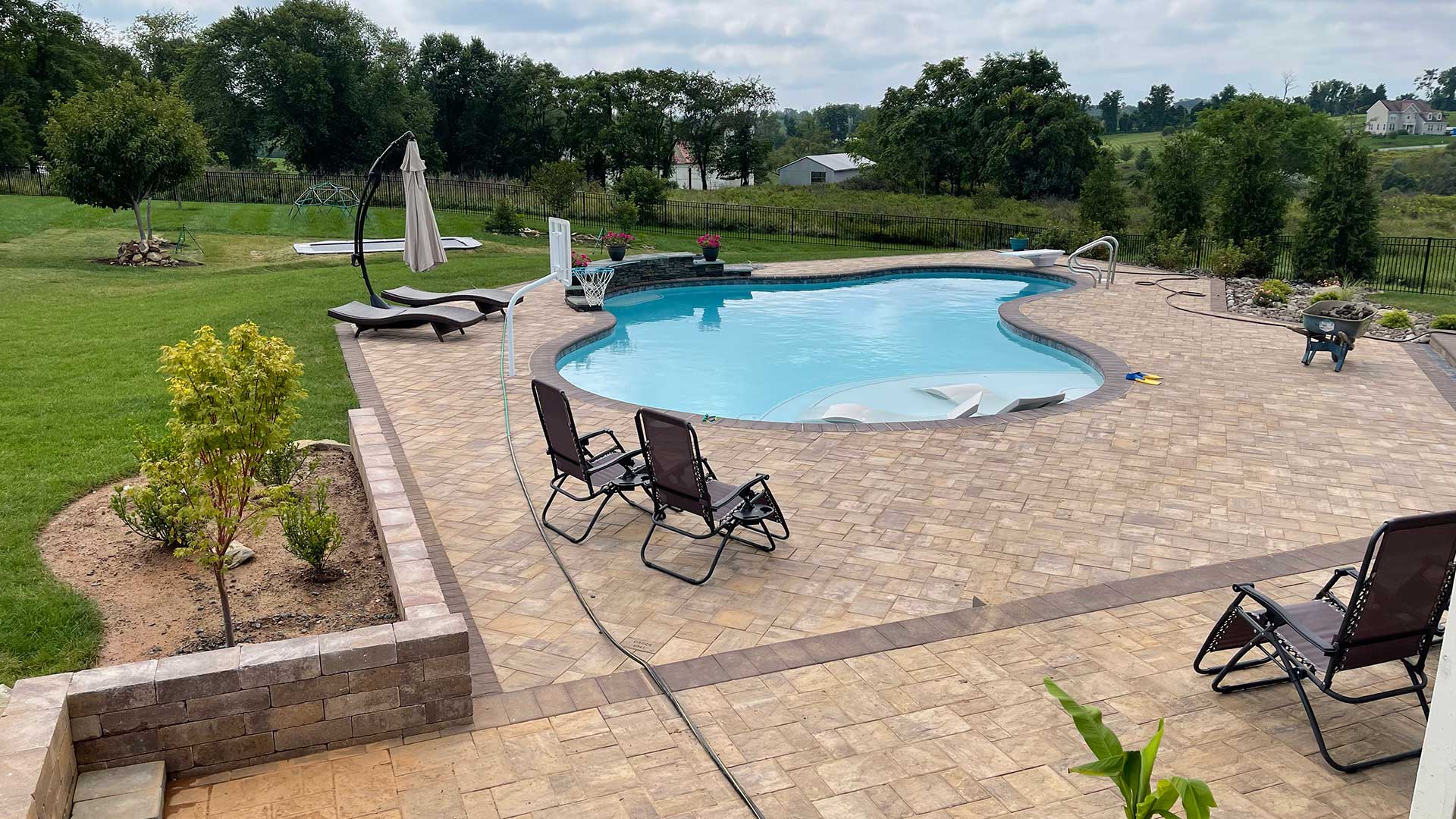 Large custom patio around a pool near Purcellville, VA.