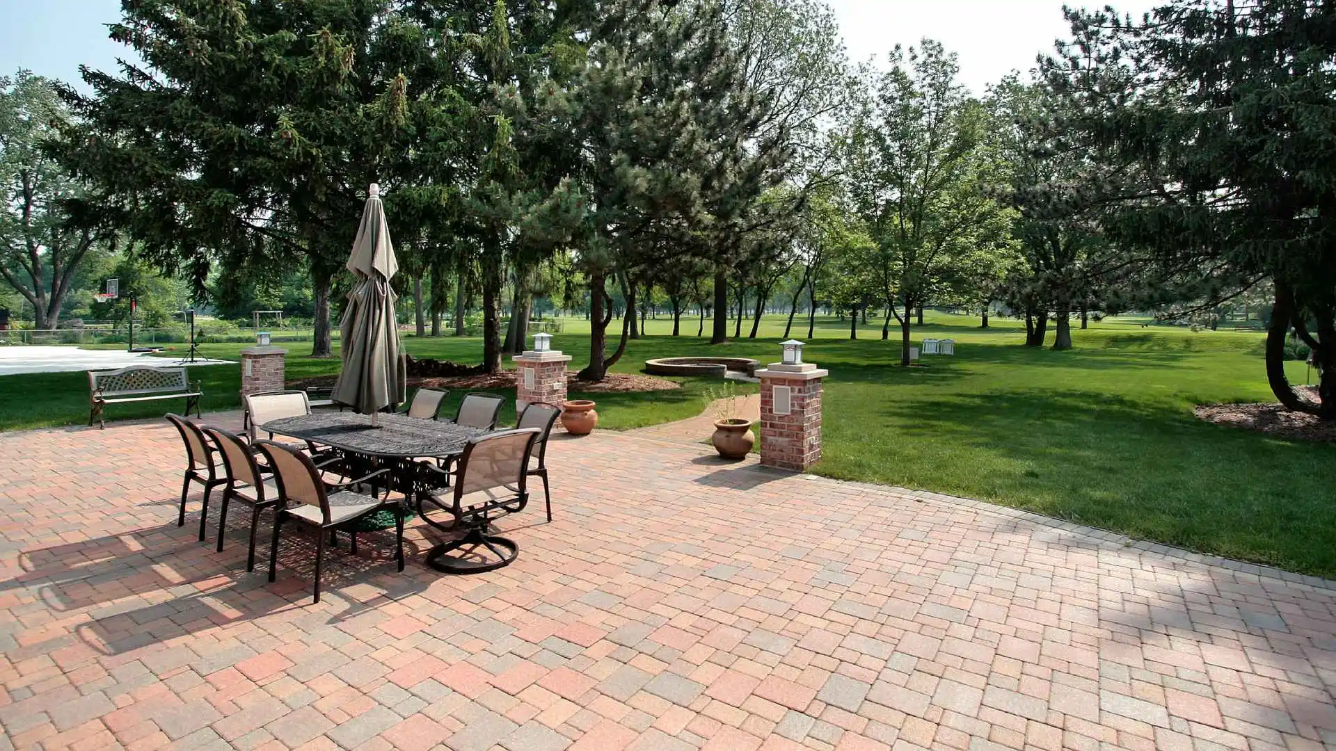 Red paver patio installed with patio set in Fauquier County, VA.