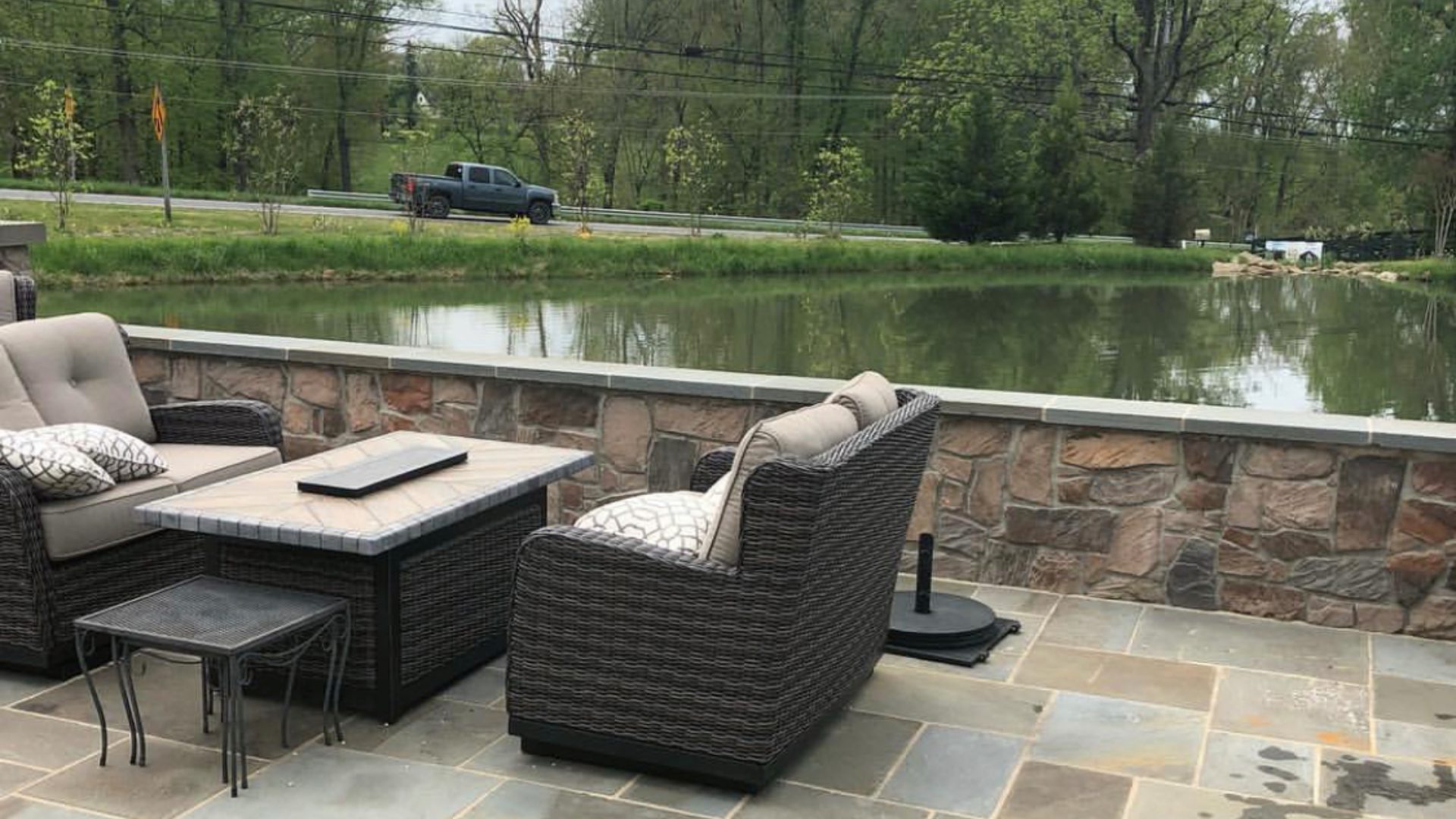 Seating wall with stone installed by patio in Leesburg, VA.
