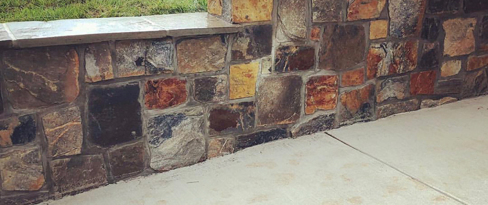 A retaining wall made out of natural stone in Purcellville, VA.