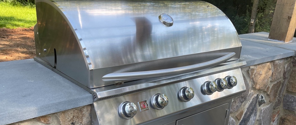Stainless steel grill installed with stone build counters in Purcellville, VA.