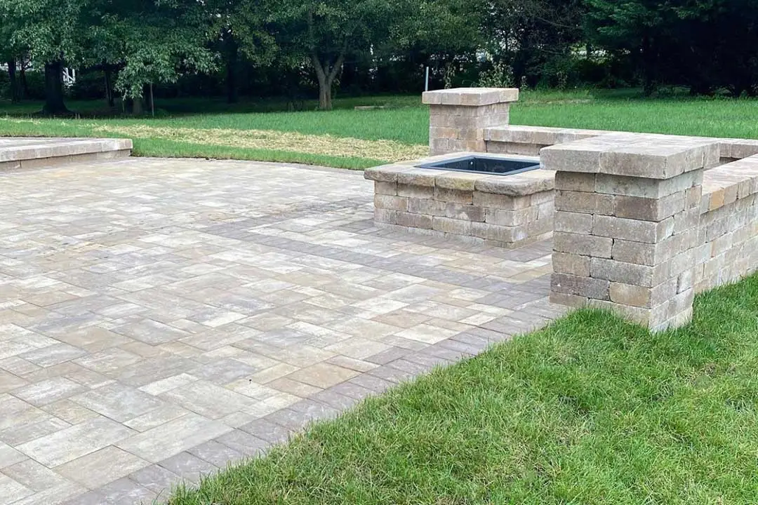 Custom patio with seating wall and fire pit near Purcellville, VA.