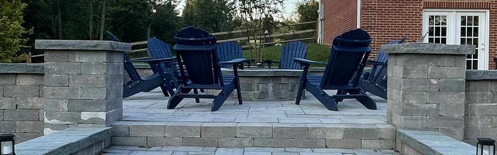Paver patio with chairs and a fire pit near Purcellville, VA.