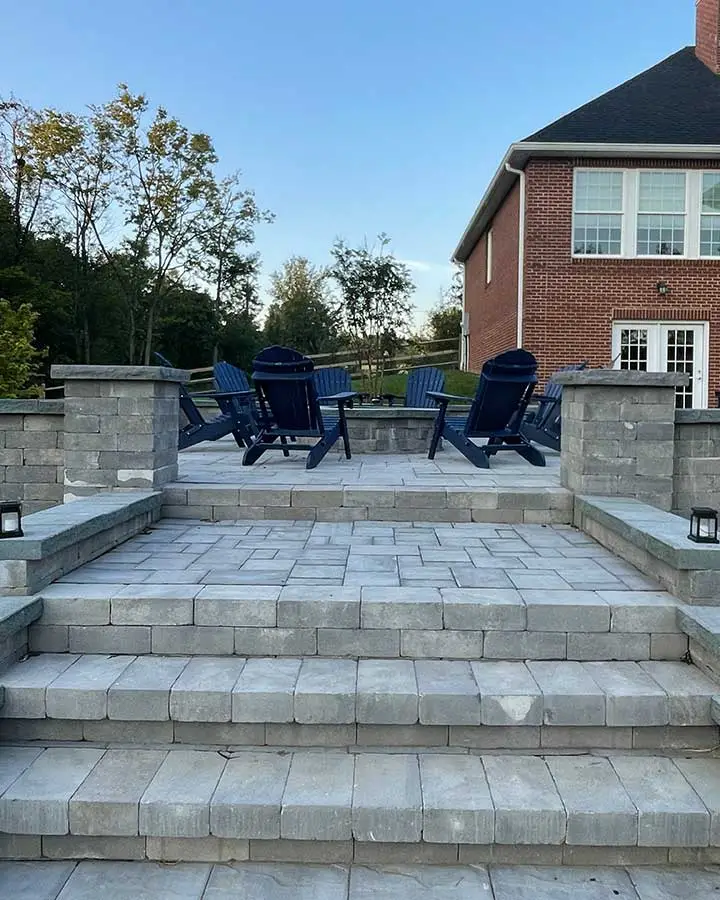 Paver patio with custom steps built at a home in Haymarket, VA.