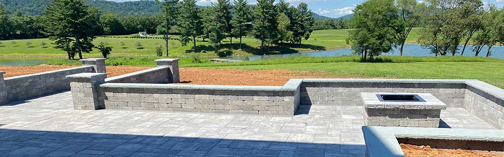 Custom paver patio and seating walls with a fire pit feature near Purcellville, VA.